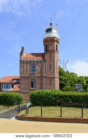 USTKA - JULY 04: Old lighthouse in the harbor on 4 July 2015 in Ustka, Poland.