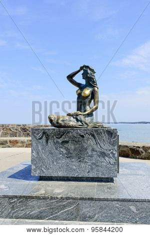 USTKA - JULY 04: A famous statue of the Mermaid in entrance to harbor on 4 July 2015 in Ustka, Poland.