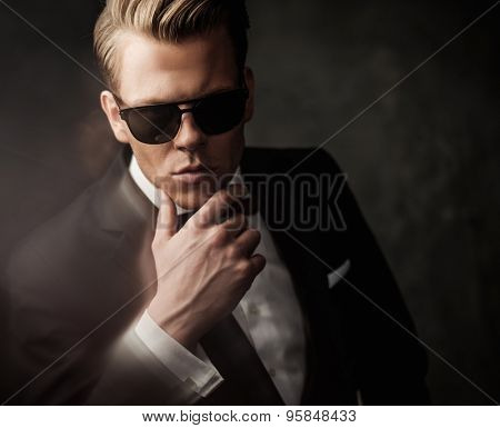 Tough sharp dressed man in black suit 