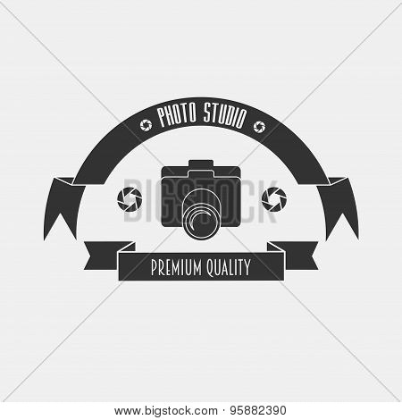 The Layout For The Studio Logo In Vintage Style With A Camera And ribbons.