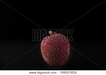 Ripe asian lychee fruit isolated on black background