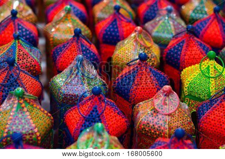 Colorful handicraft lanterns laid out together. Various designs and colors are available