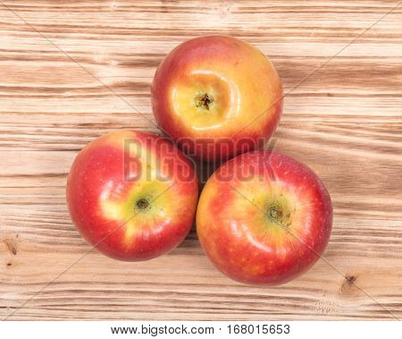 Ripe organic kanzi apple on vintage wooden tray