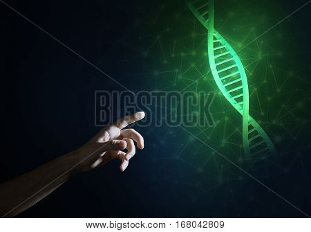Close of man hand presenting DNA molecule research as concept. Mixed media
