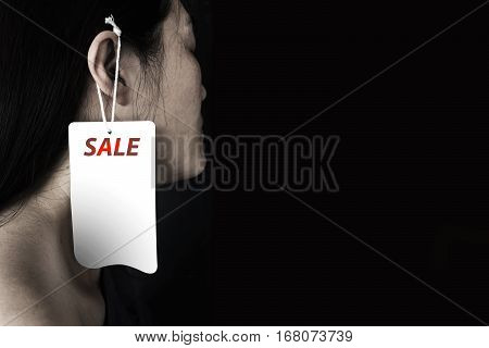 Woman With Label Hanging On Ear It (human Trafficking)