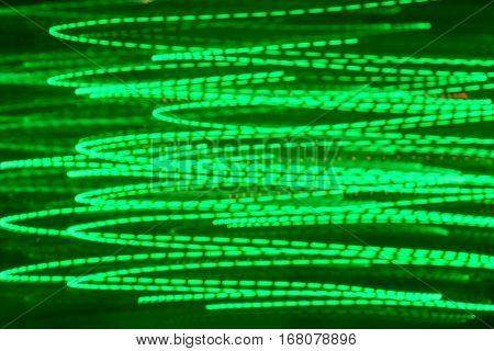 Defocus lights bokeh motion blur abstract background. Bright neon green.