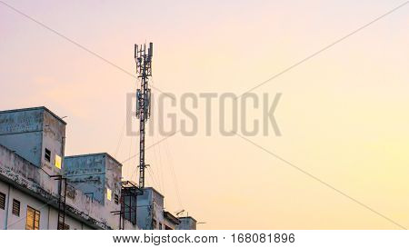 Communication cell phone and background concept - Cell phone antenna on tower with morning sky and could with copyspace