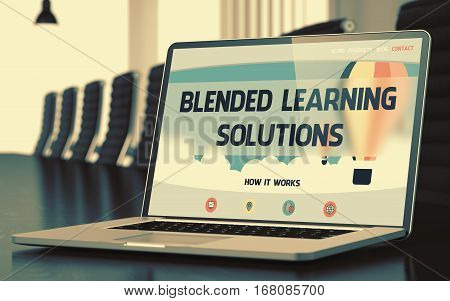 Blended Learning Solutions on Landing Page of Laptop Display in Modern Conference Room Closeup View. Toned Image. Selective Focus. 3D Render.