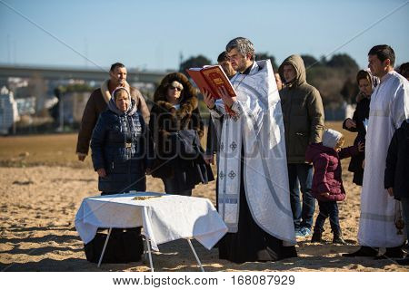 PORTO, PORTUGAL - JAN 19, 2017: Celebrating Baptism of Jesus and Epiphany bathing in Douro river in the Parish of Russian Orthodox Church. This is one of the holiest holidays for all Christians.