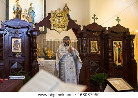 PORTO, PORTUGAL - JAN 19, 2017: During celebrating Baptism of Jesus in the Parish of Russian Orthodox Church. This is one of the holiest holidays for all Christians.