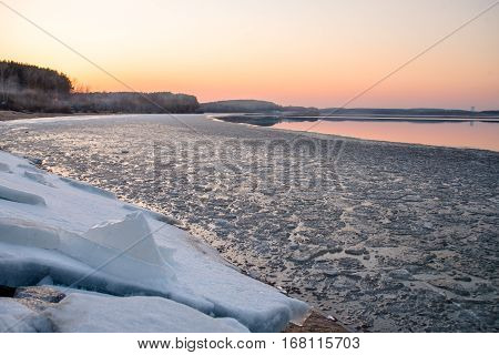 Sunset and ice on the lake in the spring