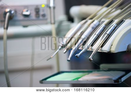 Stomatological instrument in the dentists clinic. Dental background: work in clinic. Operation tooth replacement.