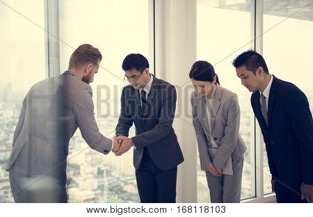 Business Partners Introductionary Handshake Bow