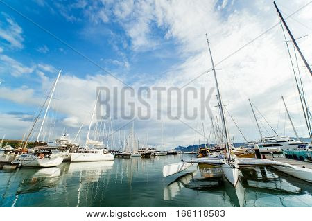 Plane over the mast. flying plane. Airplane and yacht