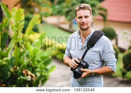 Professional photographer in the warm tropical day enjoying life