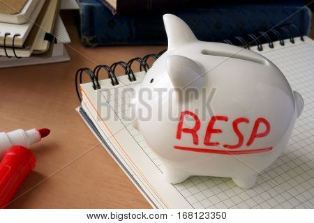 Piggy bank with word RESP. Registered Education Savings Plans.