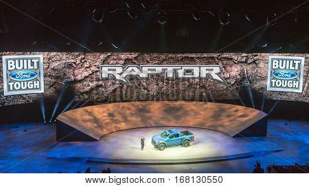 DETROIT MI/USA - JANUARY 12 2015: Ford F-150 SVT Raptor reveal at the North American International Auto Show (NAIAS) one of the most influential car shows in the world each year.