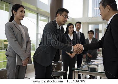 Business Partners Introductionary Handshake Bow