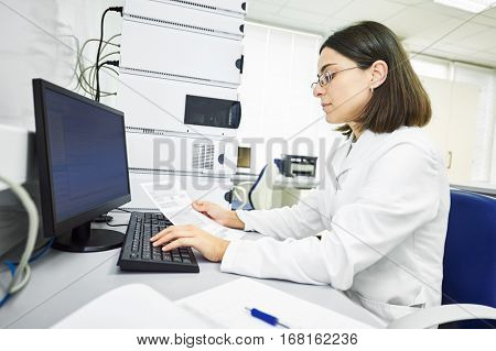 Researcher analyzing liquid chromatography data