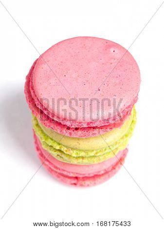 Tasty macaroons in two colors isolated on white background