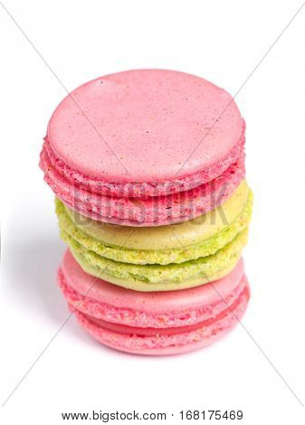 Tasty macaroons in two colors isolated on white background