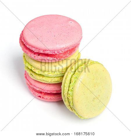 Tasty macaroons in two colors isolated on white background