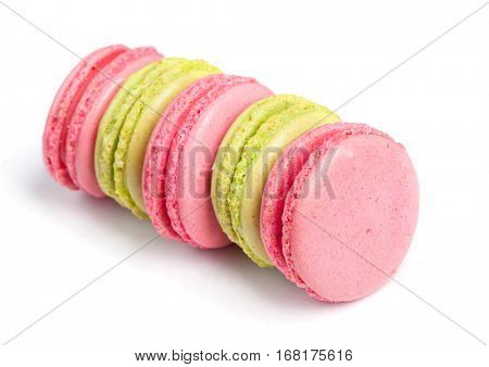 Tasty macaroons in two colors isolated on white background
