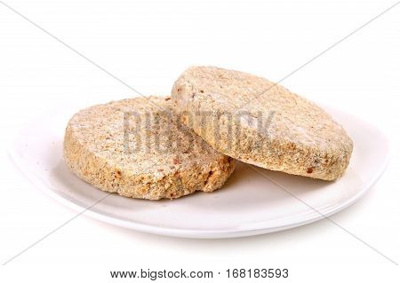Frozen Ground Meat On A White Plate