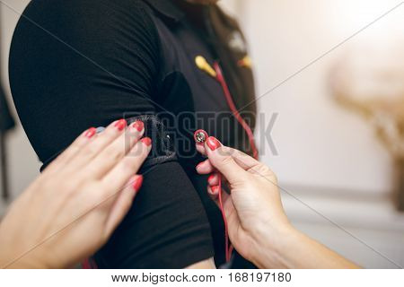 Woman Hands Attaching Electrode On Ems Suit