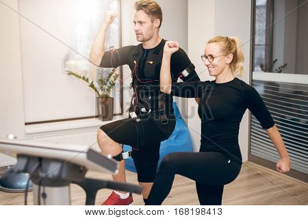 Sportsman Doing Ems Training With Personal Trainer