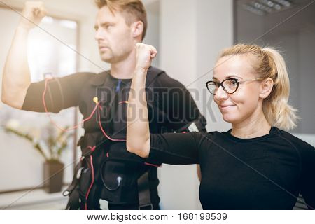 Happy Woman Training At Gym With Sportsman