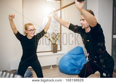 Cheerful Sportsman Working Out With His Personal Coach