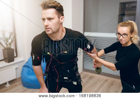 Hard Working Sportsman And His Personal Trainer