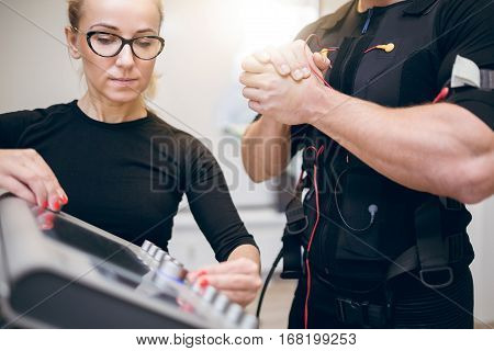 Trainer Setting Up Ems Device