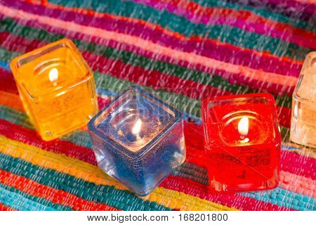 red yellow orange white  blue candle .