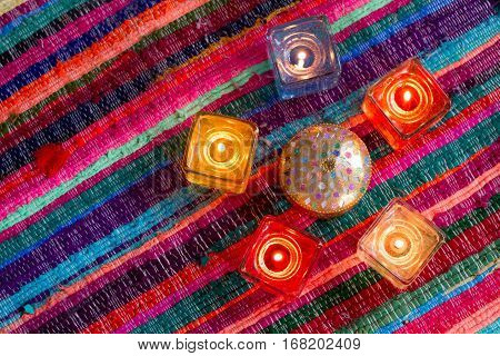 red yellow orange white  blue candle .