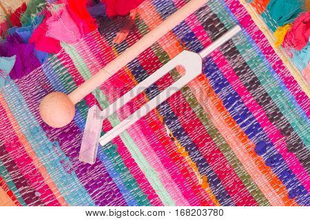 tuning fork and crystal on table .