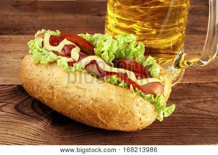 Hot Dog With Glass Of Beer On Wooden Board