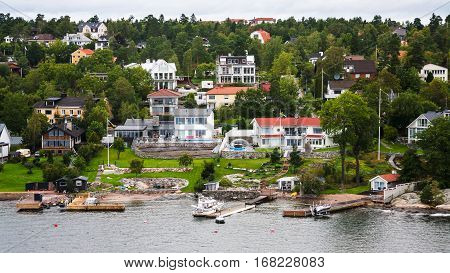 above view of village in green forest in suburbs of Stockholm city on the Baltic Sea coast Sweden