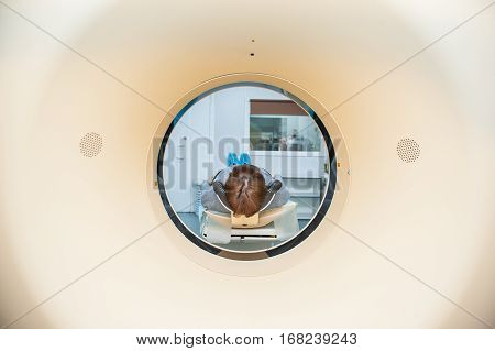 Close Up Patient At Ct Scan Tomography In Hospital, Shot Through The Tube Of Device. Selective Focus