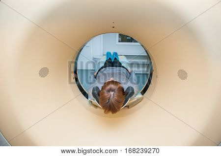 Close Up Patient At Ct Scan Tomography In Hospital, Shot Through The Tube Of Device. Selective Focus