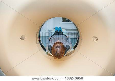 Close Up Patient At Ct Scan Tomography In Hospital, Shot Through The Tube Of Device. Selective Focus