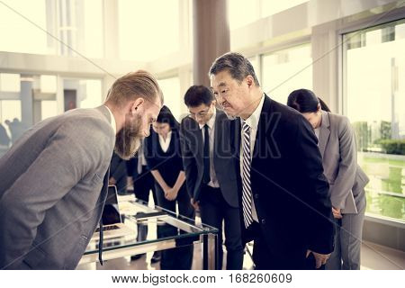 Business Partners Introductionary Handshake Bow