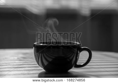 large cup of hot coffee. black and white photography,