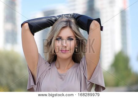 beautiful young woman posing outdoors 