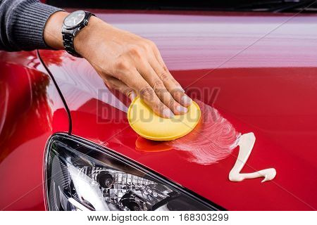 car care polishing the red car, transportation concept