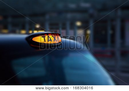 Dome lamp of classic black cab in London - selective focus
