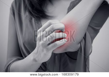 People scratch the itch with hand elbow itching Concept with Healthcare And Medicine.