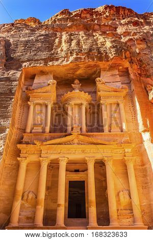 Yellow Golden Treasury Morning Siq Petra Jordan Petra Jordan. Treasury built by the Nabataens in 100 BC. Yellow Canyon becomes rose red when sun goes. Inside buildings walls create many abstracts close up. The rose red can become blood red. Reds are creat