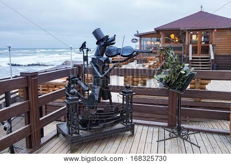 ZELENOGRADSK, KALININGRAD REGION, RUSSIA - January 26, 2017: Sculpture of iron stray dogs musicians which play a musical instrument in the popular russian sea resort Zelenogradsk (Cranz).